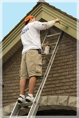 Painter applying exterior trim