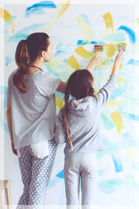 Mother and daughter testing paint colors