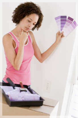 woman looking at purple paint samples